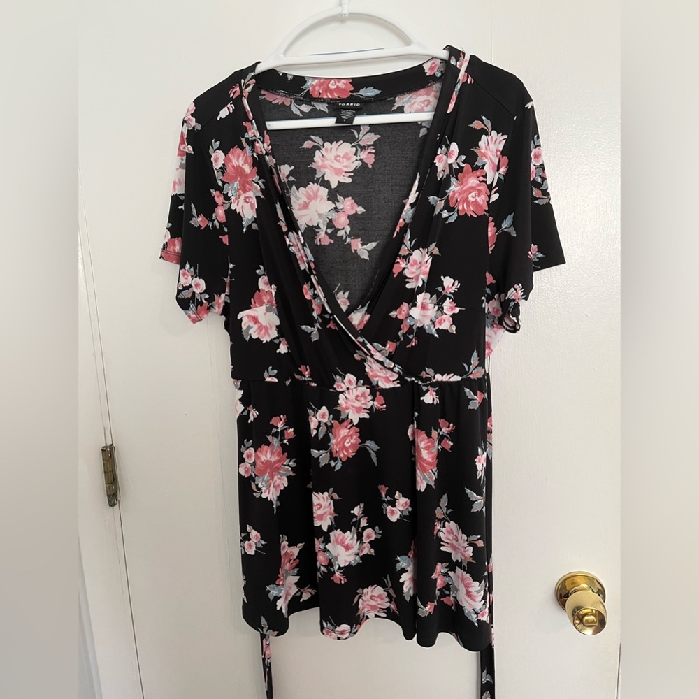 Torrid black and floral wrap top. Size 1